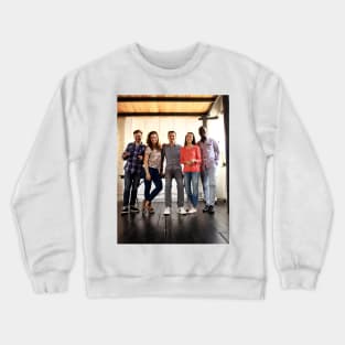 Happy Young People In A Meeting Looking At Camera And Smiling. Young Designers Working Together On Creative Project. Crewneck Sweatshirt